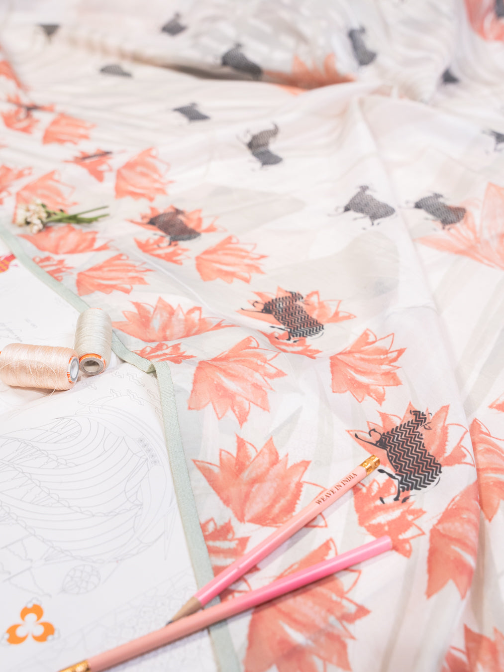 Pearl White Silk Chiffon Saree with Cow and Lotus Motifs