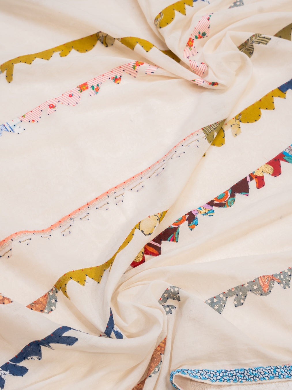 Off White Cotton Saree with Colourful Patchwork Stripes and Beaded Border