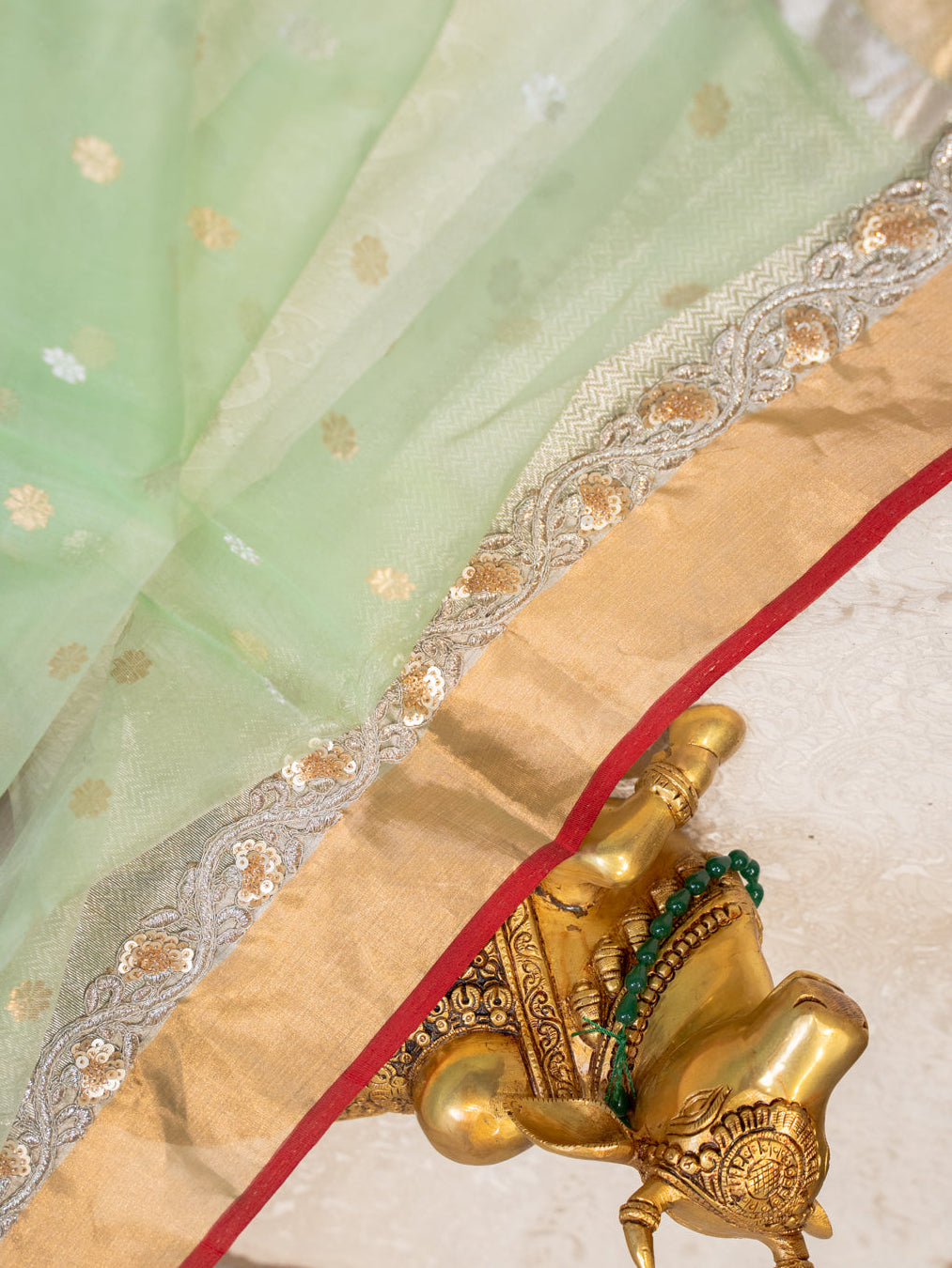 Mint Green Silk Organza Saree with All Over Buttis and Silver Zardozi Border