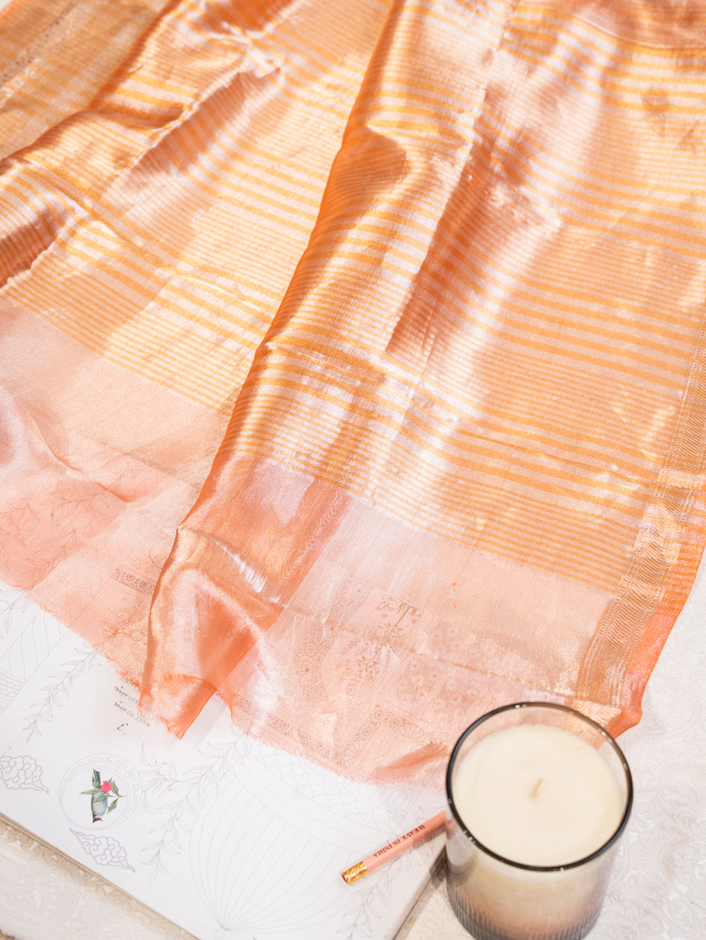 Peach Silk Tissue Saree with Golden Border and All Over Buttis