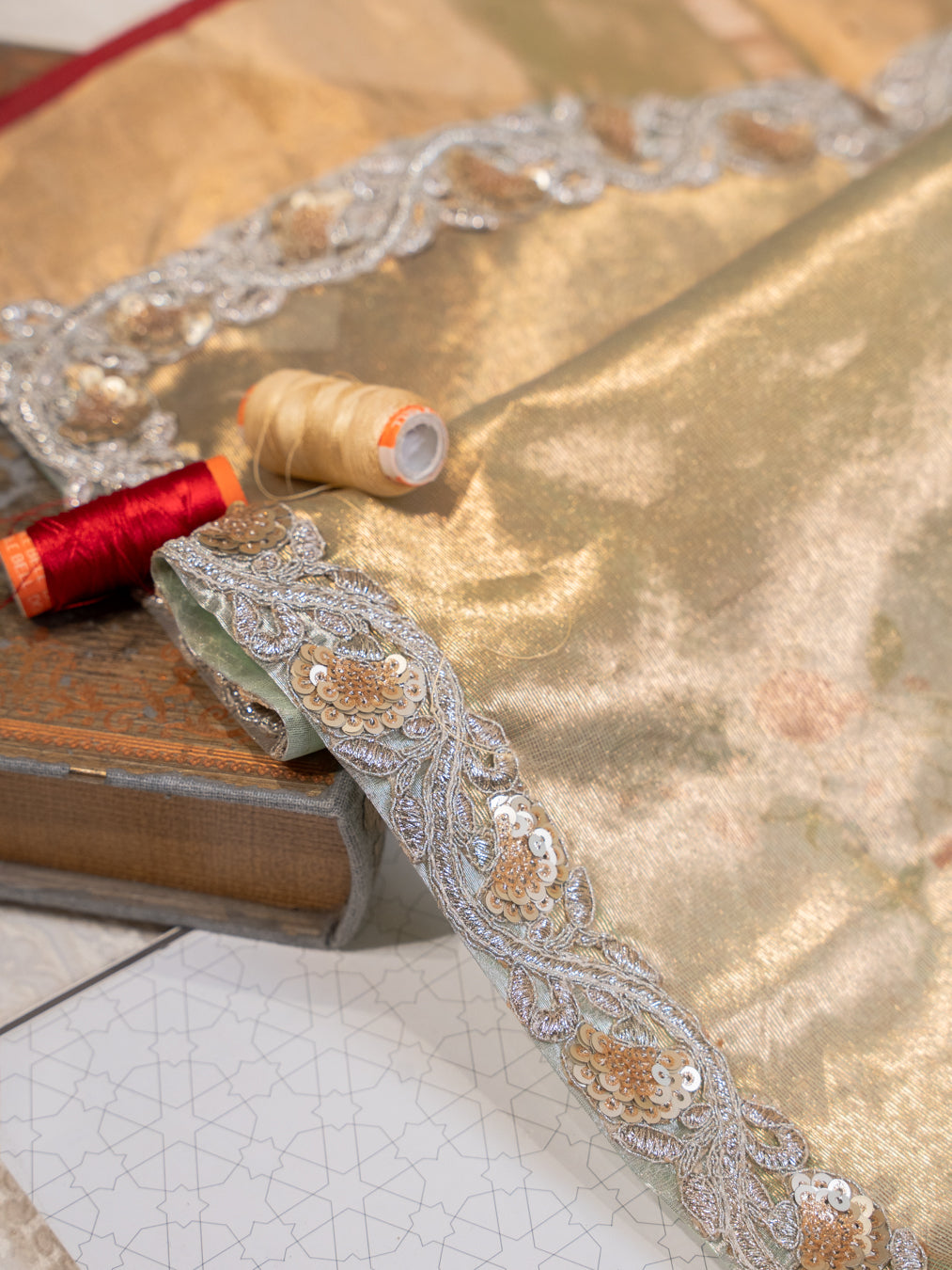 Mint Green Silk Organza Saree with All Over Buttis and Silver Zardozi Border