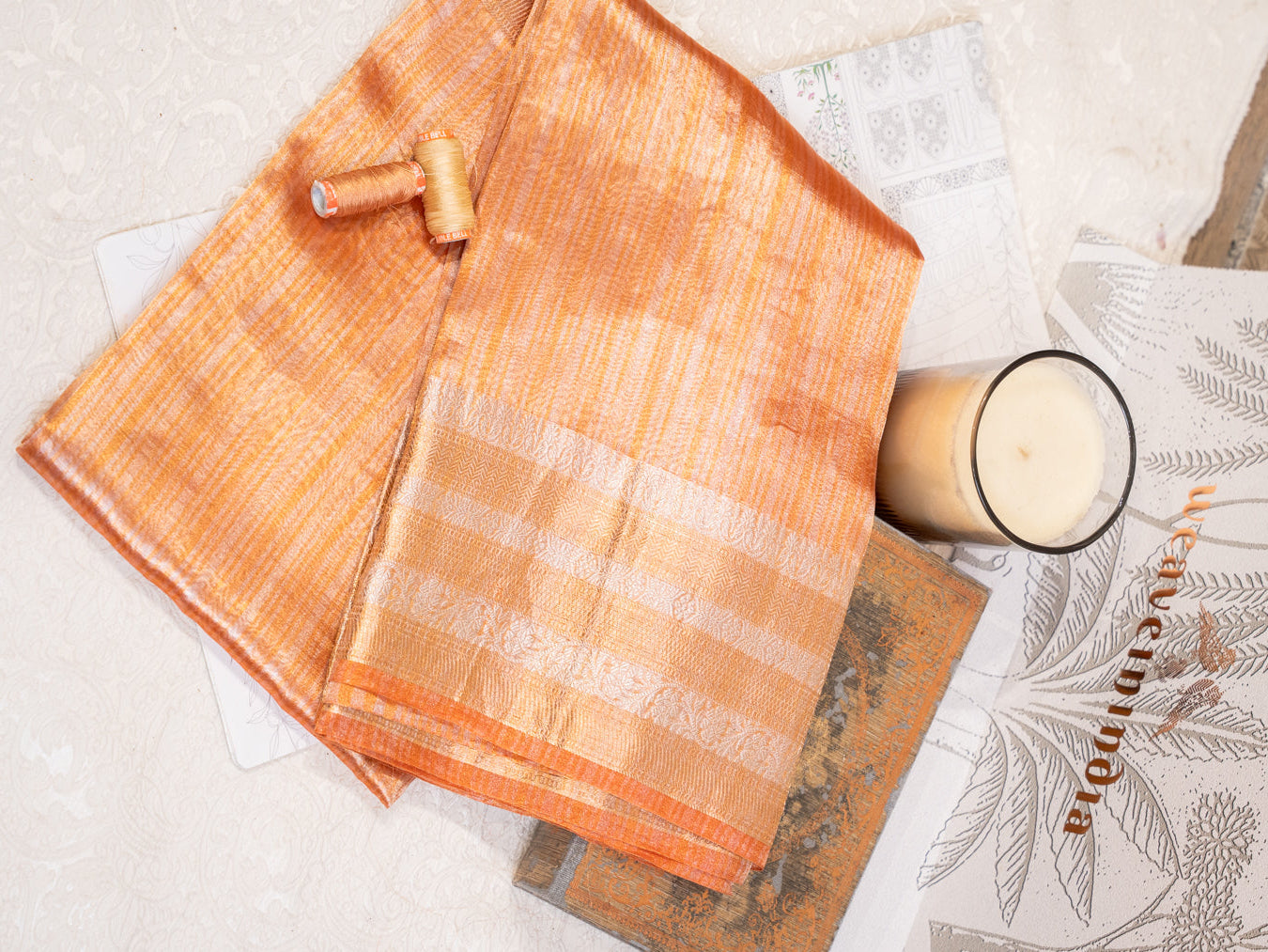Peach Silk Tissue Saree with Golden Border and All Over Buttis