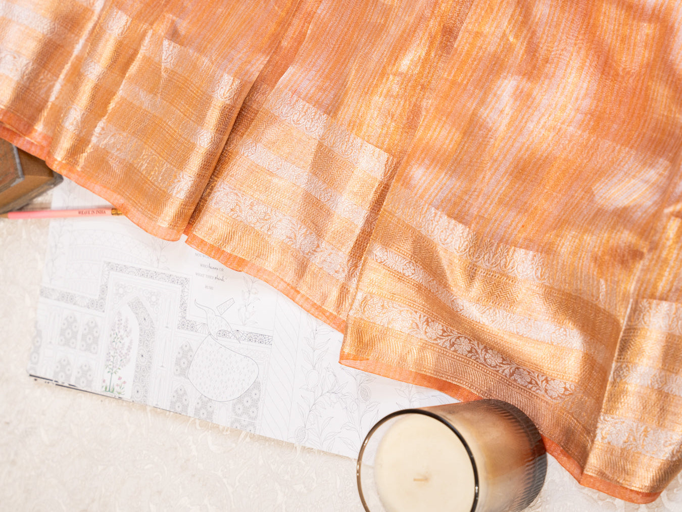 Peach Silk Tissue Saree with Golden Border and All Over Buttis