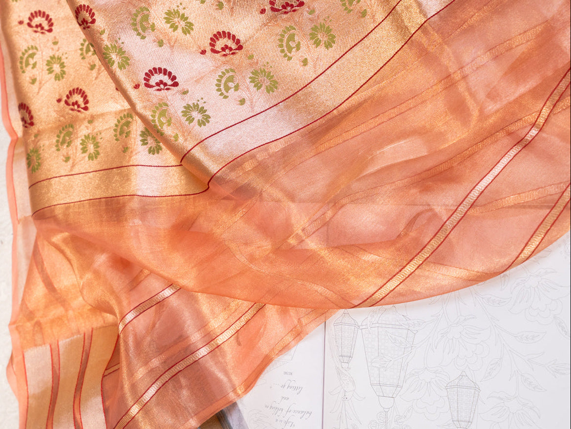 Peach Silk Tissue Saree with Golden Border and All Over Buttis