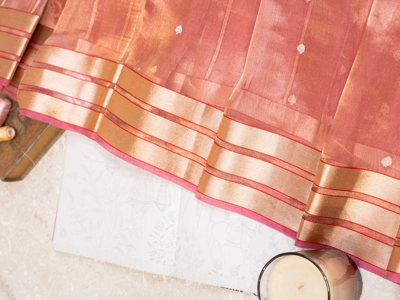 Coral Silk Tissue Saree with Golden Border and All Over Buttis